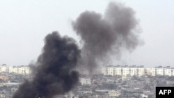 Smoke billows from a targeted location inside the northern Gaza Strip.