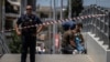 Greek police experts search for evidence outside AEK Athens' OPAP Arena on August 8 after a Greek fan was stabbed to death on the outskirts of Athens.