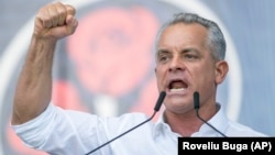 Vladimir Plahotniuc gestures as he addresses a political rally in Chisinau on June 9, 2019, just before he fled the country.