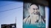 A poster of former warlord Abdul Ali Mazari hangs along a street in Mazar-e Sharif in June 2015.