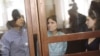 Members of Pussy Riot during a court hearing in Moscow on July 30: Nadezhda Tolokonnikova (left), Yekaterina Samutsevich (center), and Maria Alyokhina. They face up to seven years in prison.