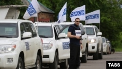 OSCE observers arrive in the village of Zaytseve in the Donetsk region in May.