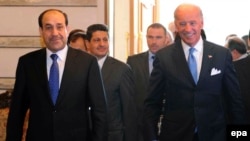 Despite a recent visit from U.S. Vice President Joe Biden (right), Iraqi Prime Minister Nuri al-Maliki has shown no inclination to interfere in the vetting commission's banning of candidates.