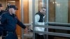 Gordon Black is escorted into a Russian courtroom on June 6.