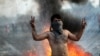 An Iraqi demonstrator gestures during ongoing anti-government protests in Baghdad.