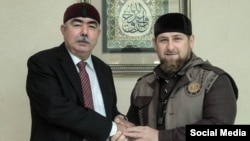 Afghan First Vice President Abdul Rashid Dostum (left) meets with Chechnya's Ramzan Kadyrov in Grozny on October 5.