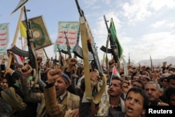 Protesters, mainly Huthi supporters, shout slogans as they rally to show support for Palestinians and Lebanon's Hezbollah in Sanaa, Yemen, on November 8.