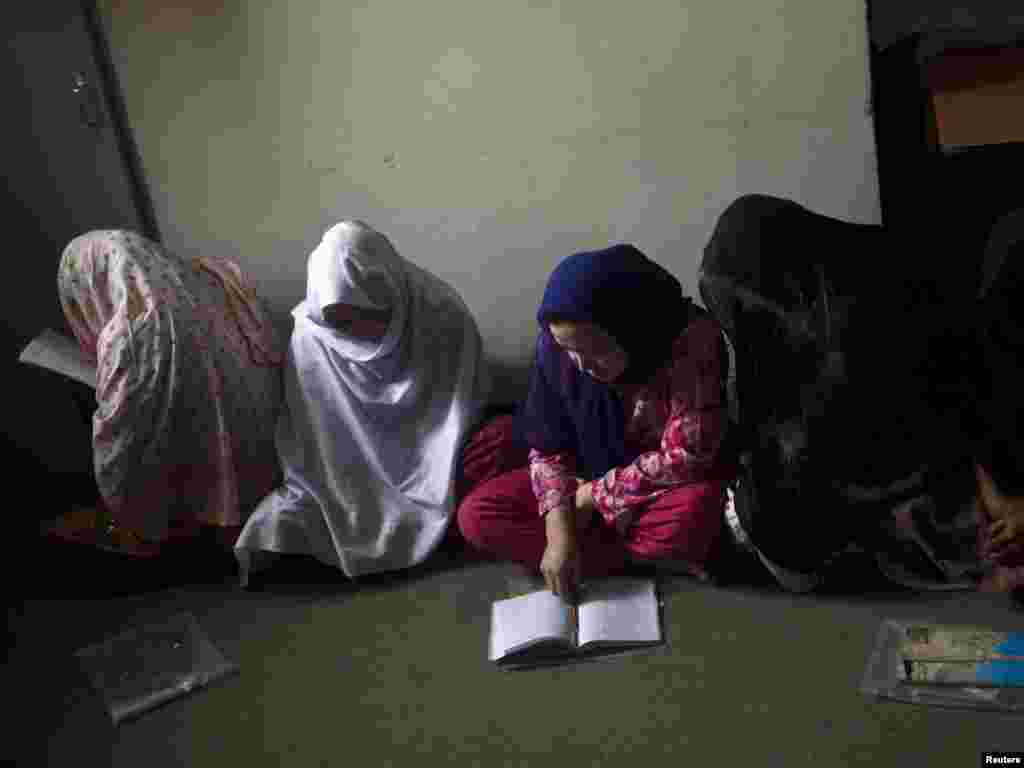 Female prisoners in a Kabul, Afghanistan, prison learning to read (Reuters). - Breaking the cycle of overpopulation and poverty also depends on universal literacy. The Earth Policy Institute estimates that spending of $4 billion per year will be needed to end illiteracy. Nobel laureate Amartya Sen says "illiteracy and innumeracy are a greater threat to humanity than terrorism."