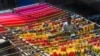 A Pakistani worker dries fabric threads after dyeing them at a factory in Lahore.