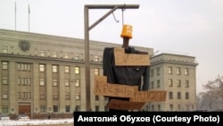 Cardboard signs say "Business" at the top, with "Loans," Taxes," and "Electricity Bills" below