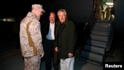 U.S. Secretary of Defense Chuck Hagel (right) is greeted by U.S. Ambassador to Afghanistan James Cunningham (center) and General Joseph Dunford, commander of the International Security Assistance Force upon Hagel's arrival in Kabul on March 8.