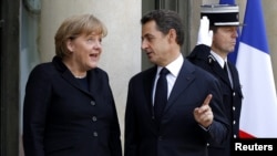 French President Nicolas Sarkozy and German Chancellor Angela Merkel say European leaders are determined to secure euro zone. 