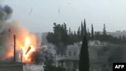 A video grab allegedly shows shelling by regime forces in Maaret al-Numan in the restive Idlib province.