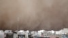 A dust storm engulfs Tehran on June 2. The storm killed five people, injured several dozen more, and knocked out power to around 50,000 homes in the Iranian capital.