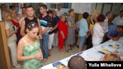 Moldovan voters at a polling station in Ialoveni on July 29