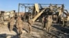 U.S. soldiers inspect the site where an Iranian missile hit at Ain al-Asad air base in Iraq's Anbar Province on January 13.