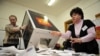 Members of the local electoral commission open ballot boxes at a polling station in Vladivostok.