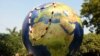 Greenpeace activists carry a globe during a mock funeral procession in New Delhi in December.