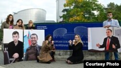 Azerbaijani rights activists protest in front of Council of Europe in 2013.