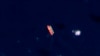 In this satellite photo provided by Planet Labs, vessels identified as the Virgo, left, and the Suez Rajan are seen in the South China Sea on February 13, 2022.