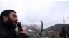 Demonstrators rally outside Imedi television station in Tbilisi on March 14, the day after the hoax broadcast.