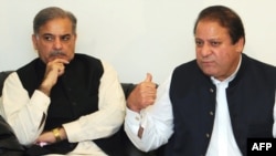 Nawaz Sharif (right), leader of the Muslim League Nawaz Group, and his brother Shahbaz Sharif in Lahore on February 25