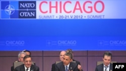 U.S. President Barack Obama (center) speaks during the heads of state and government's North Atlantic Council meeting on day one of the NATO summit in Chicago on May 20.