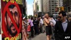 Demonstrators participate in a rally against Ahmadinejad near the Warwick New York Hotel on September 24.