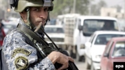 An Iraqi policeman at a checkpoint in central Baghdad (file photo)