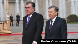 Uzbek President Shavkat Mirziyoev (right) is welcomed by Tajik President Emomali Rahmon in Dushanbe on March 9.