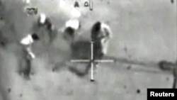 A video grab from cockpit recordings shows Iraqis being shot from a U.S. Apache helicopter on July 12, 2007. Reuters photographer Namir Noor-Eldeen also died in the incident.