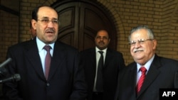 President Jalal Talabani (right) and Prime Minister Nuri al-Maliki in archive photo from Baghdad