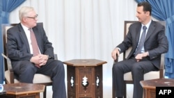 Russian Deputy Foreign Minister Sergei Ryabkov (left) meets with Syrian President Bashar al-Assad in Damascus in mid-September.