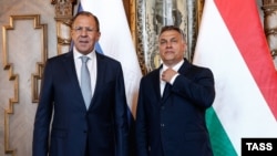 Russian Foreign Minister Sergei Lavrov (left) meets with Hungarian Prime Minister Viktor Orban in Budapest on May 25.