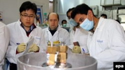 An International Atomic Energy Agency team checks the enrichment process inside the uranium enrichment plant at Natanz in January 2014.