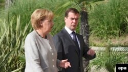 Medvedev and Merkel during a meeting in Sochi on August 15