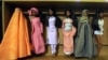 It seems these Barbie dolls wearing cultural clothes from around the world would not be welcome in Tajikistan, which is seeking to promote the country's traditional dress. (file photo)