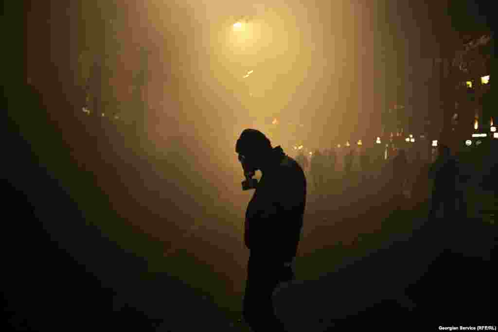 A protester wearing a gas mask amid heavy police use of tear gas on December 1.&nbsp;