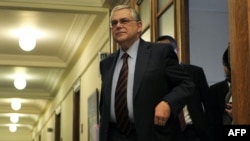 Greek Prime Minister Lucas Papademos arrives for a cabinet meeting at the Greek parliament in Athens on March 8.