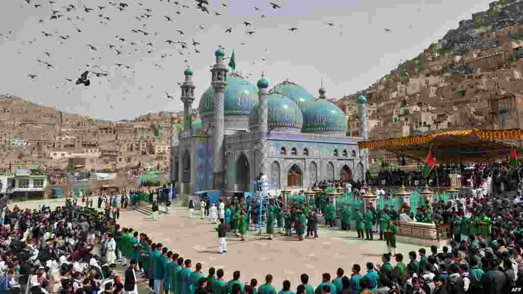 People gather for a New Year&#39;s ceremony at the Sakhi Shrine in Kabul in March.