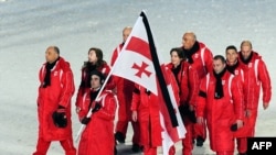 Members of the Georgian Olympic team wore black armbands and a black stripe graced the Georgian flag during the opening ceremonies of the Winter Olympics in Vancouver.