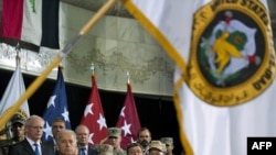 The U.S.-Iraqi change-of-command ceremony in Baghdad on September 1, with Vice President Joe Biden and Defense Secretary Robert Gates (front left to right) in attendance