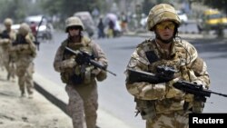 British soldiers patrol a street in Kabul.