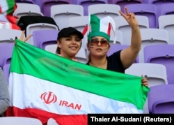 Iranian fans pose before the 2019 AFC Asian Cup semifinal match between Japan and Iran in the United Arab Emirates in January.