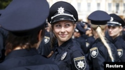 Police officers wait before an oath-taking ceremony in Kyiv on July 4.