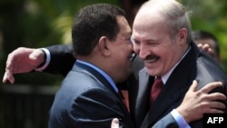 President Hugo Chavez and his Belarusian counterpart Alyaksandr Lukashenka embrace each other at the Miraflores presidential palace in Caracas.