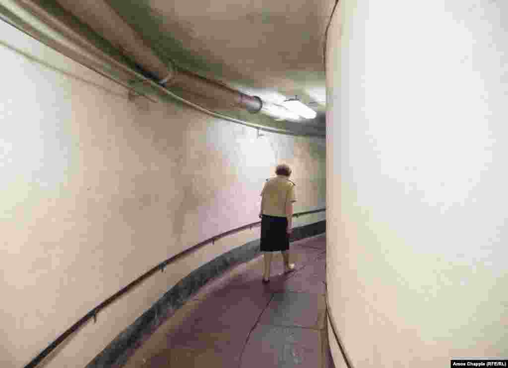 A woman walks in a corridor of the bunker. Kinder told RFE/RL: &ldquo;during the [1991 coup attempt] I was in a different city with two young kids and a plane flew over dropping leaflets saying &#39;we have a new government, you shouldn&rsquo;t rebel.&rsquo;&rdquo;