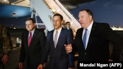 U.S. Secretary of State Mike Pompeo (right) paid an unexpected visit to Baghdad last week. 