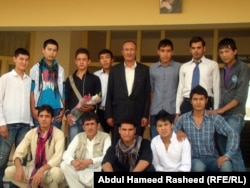 Anwari poses with some of his students at the Abdul Ali Mustaghni High School in Kabul.