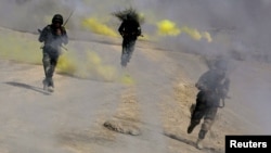 Soldiers of the Afghan National Army shown here taking part in a training exercise in Kabul in October 2013.